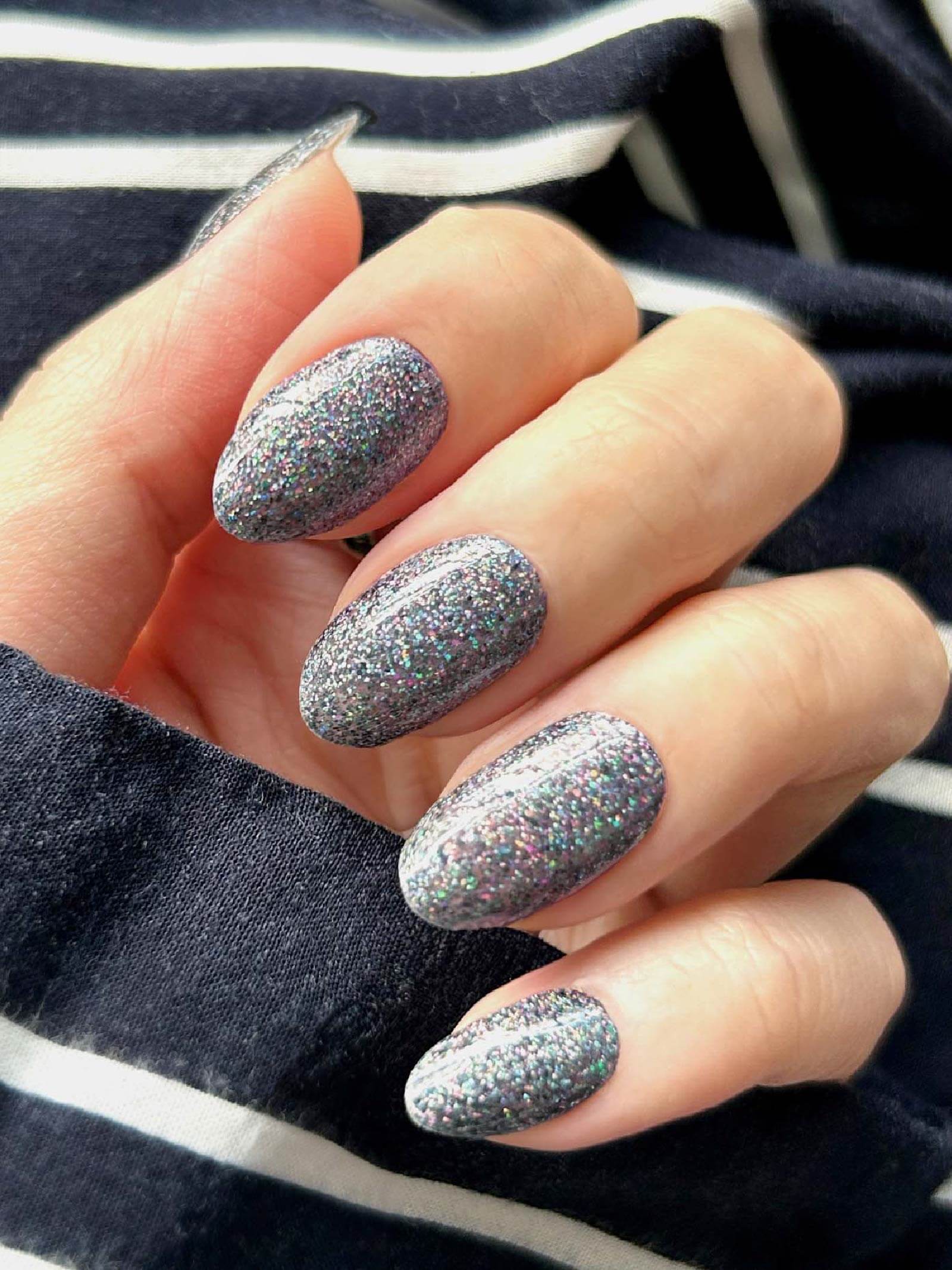 Bold black nail art stickers with vibrant glitter accents