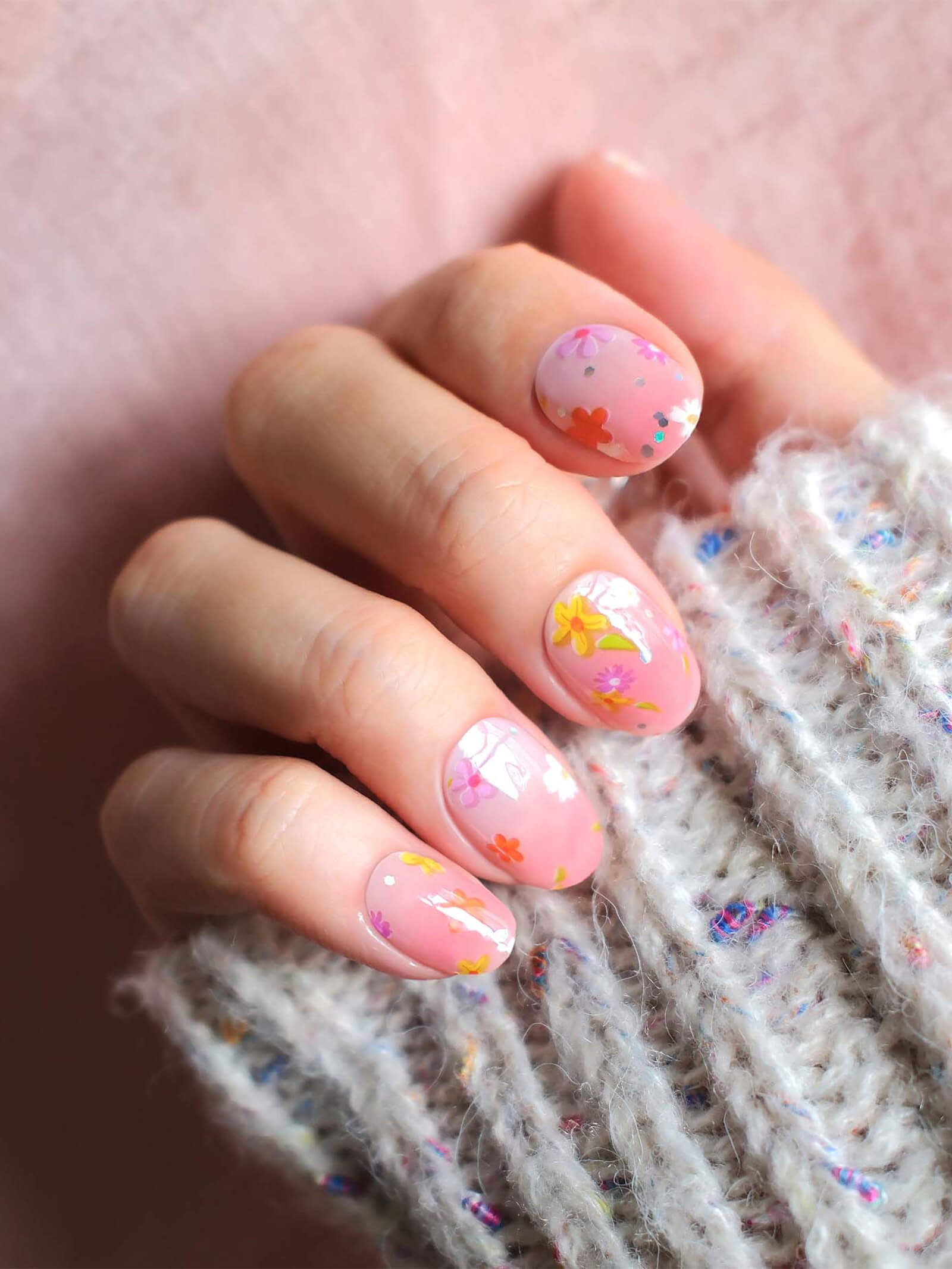 Vibrant pink gradient nail stickers with colorful flower designs