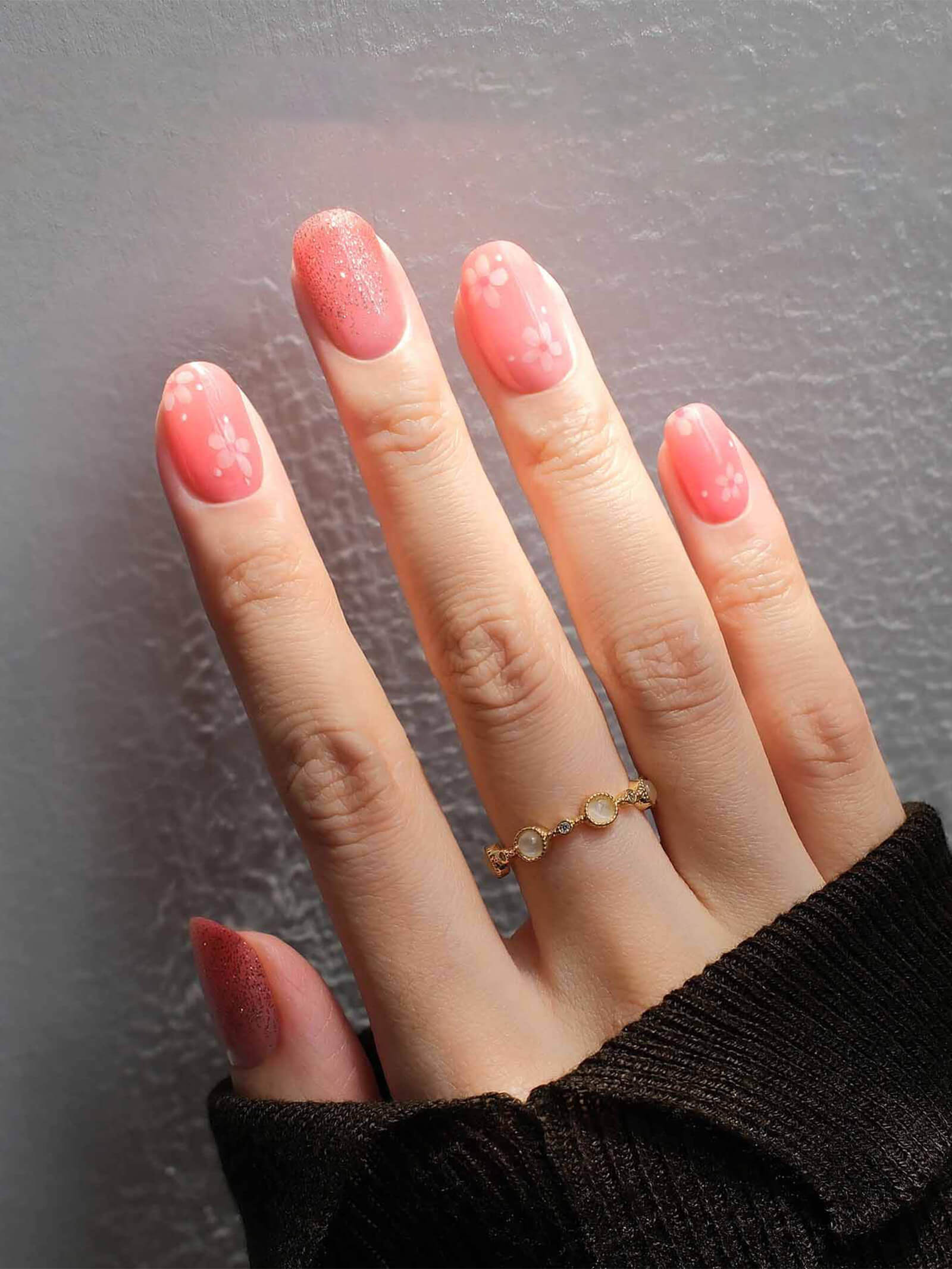 Soft peach-pink nail stickers adorned with delicate flowers