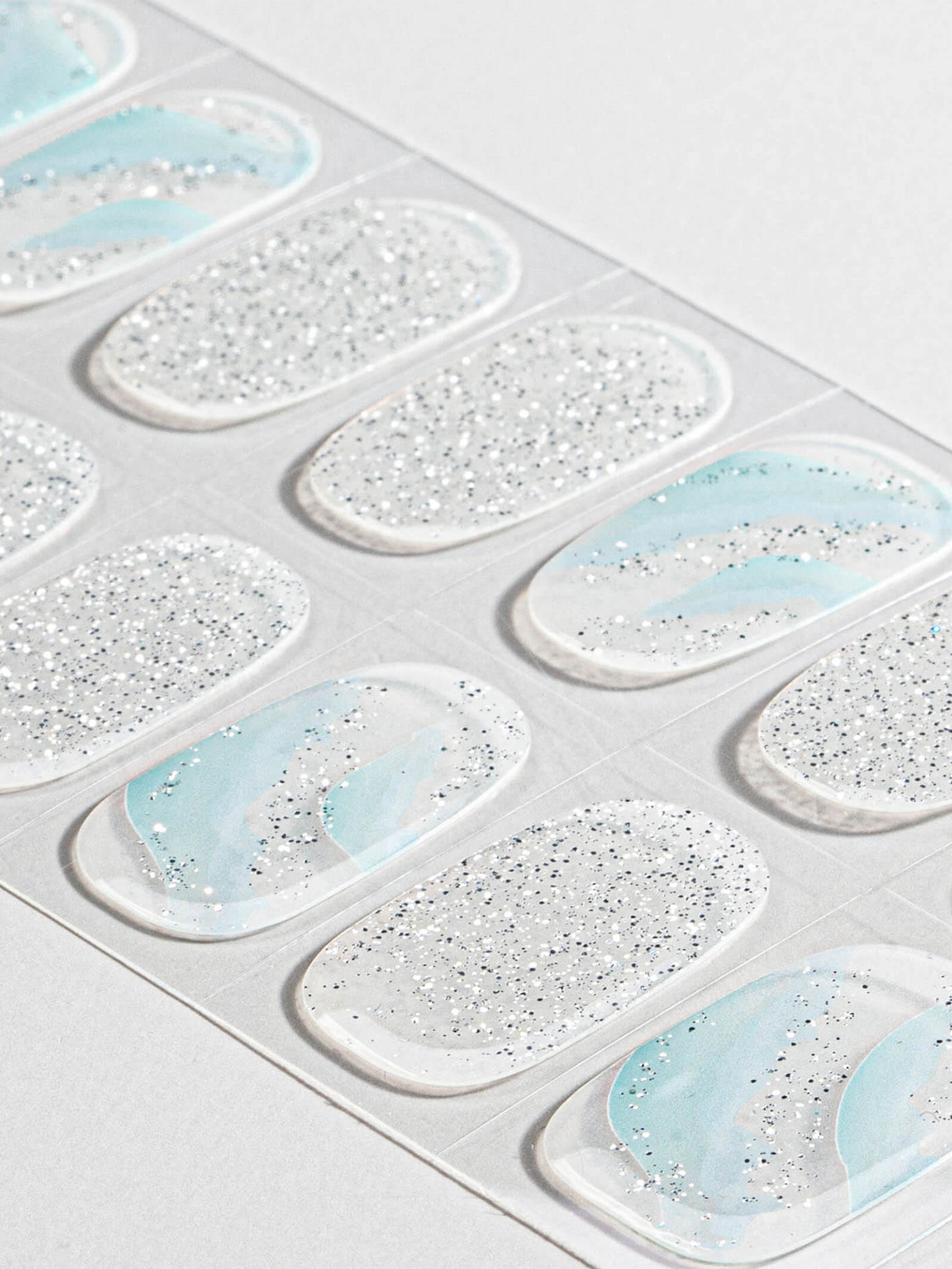 Clear blue and white ombre nail stickers with subtle sparkle