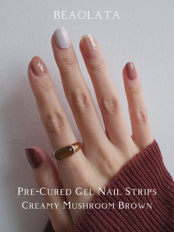 Chic French-style gel nail stickers in cream brown, white, and glitter